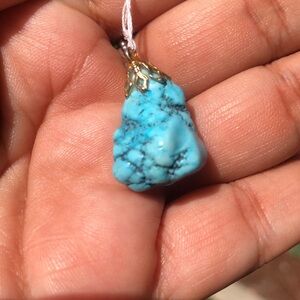 Turquoise Color stone Pendant with Gold color accents